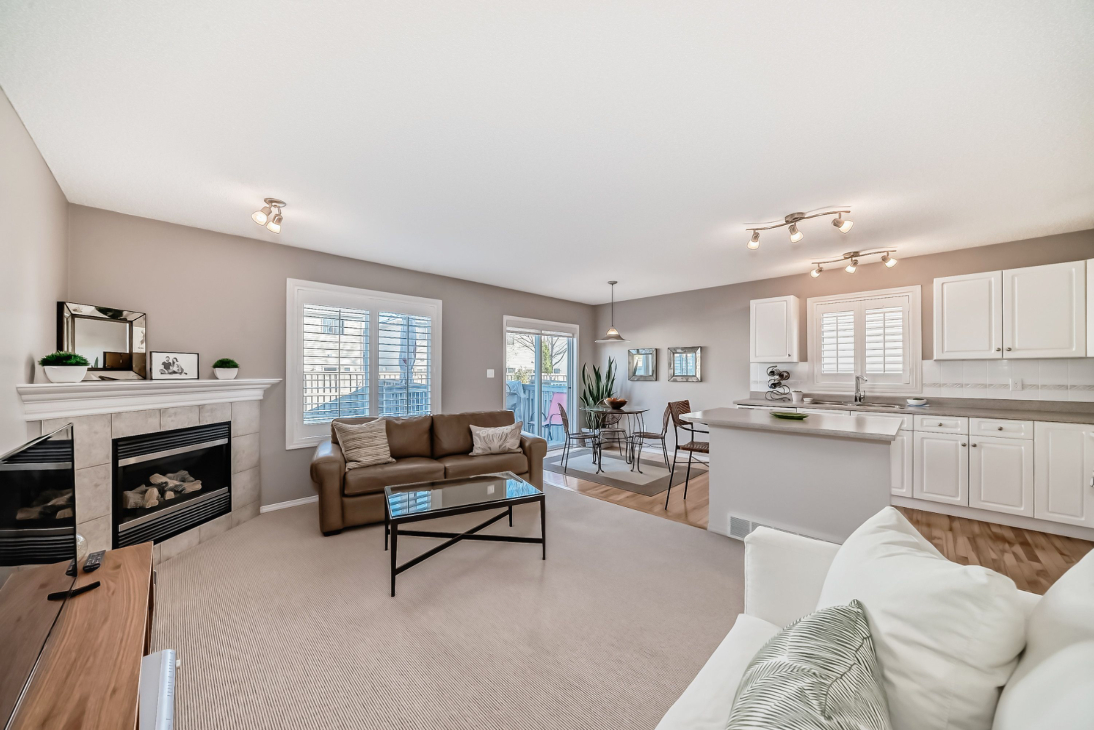 Open House. Open House Alert! Join us this Sunday from 1 to 3 pm to tour this bright, well-maintained duplex in MacEwan. Featuring 3 spacious bedrooms, a cozy fireplace, white kitchen with island, and a fenced yard—this home has it all!