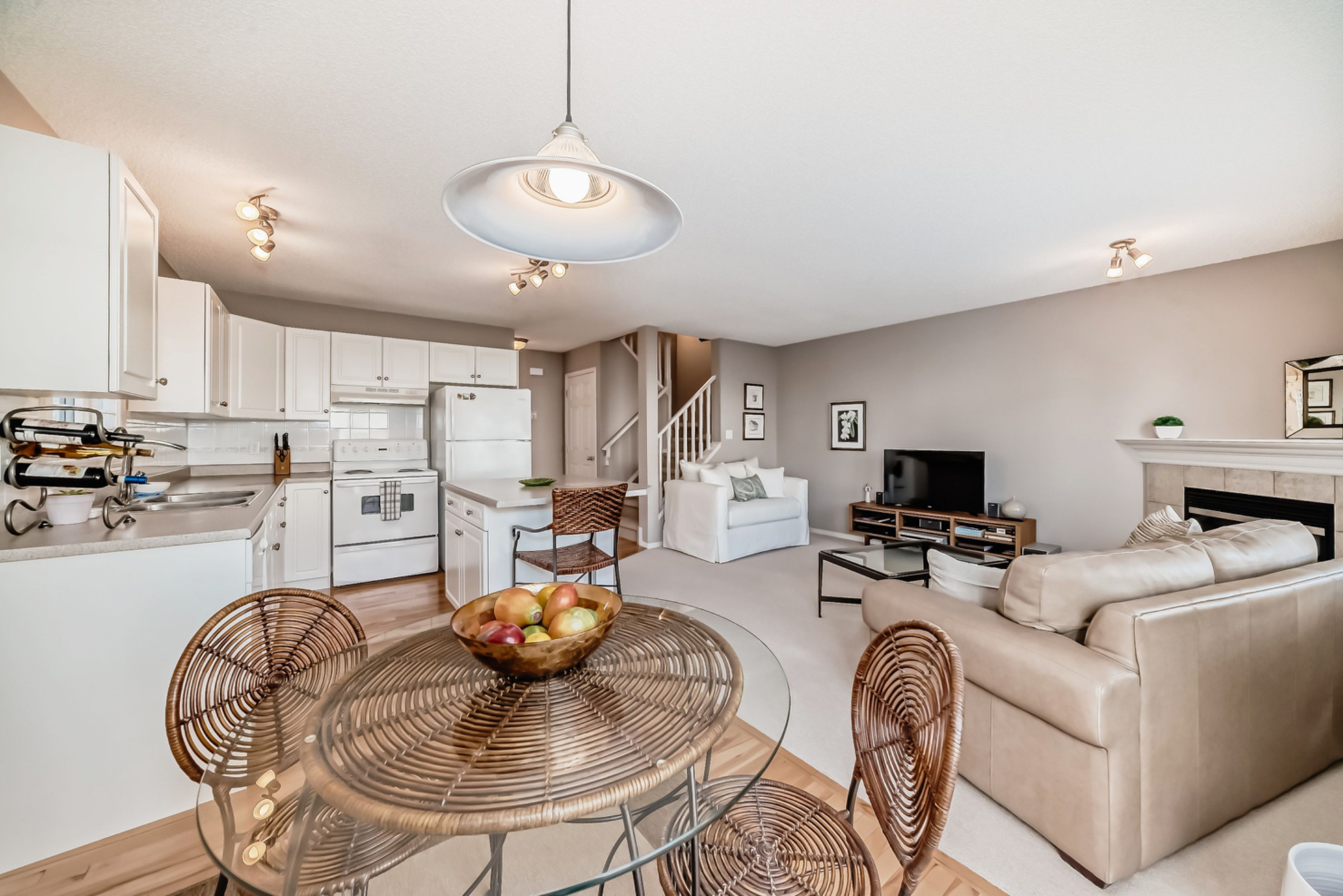 Open House. Open House Alert! Join us this Sunday from 1 to 3 pm to tour this bright, well-maintained duplex in MacEwan. Featuring 3 spacious bedrooms, a cozy fireplace, white kitchen with island, and a fenced yard—this home has it all! Located at the en